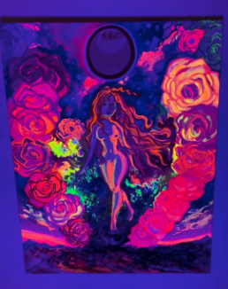 Letting Go of A Dead Past glowing under UV black light, revealing the luminous cosmic and floral elements of the painting